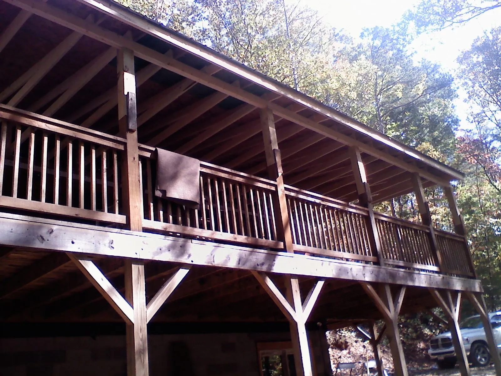 Timber framing under a new elevated porch and deck — Roof Leak Repair in New Troy by Roofing Brothers